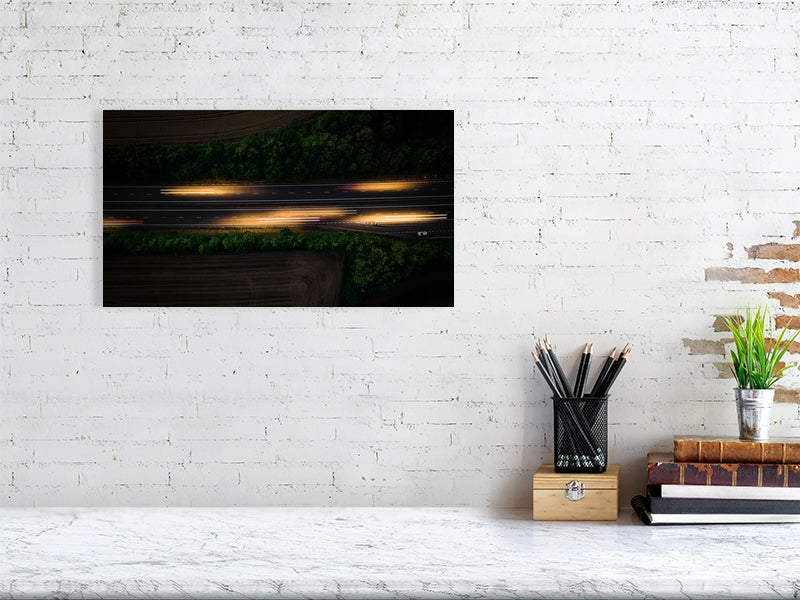 Aerial photo if motorway and light trails left by the cars. Print or framed art photography.