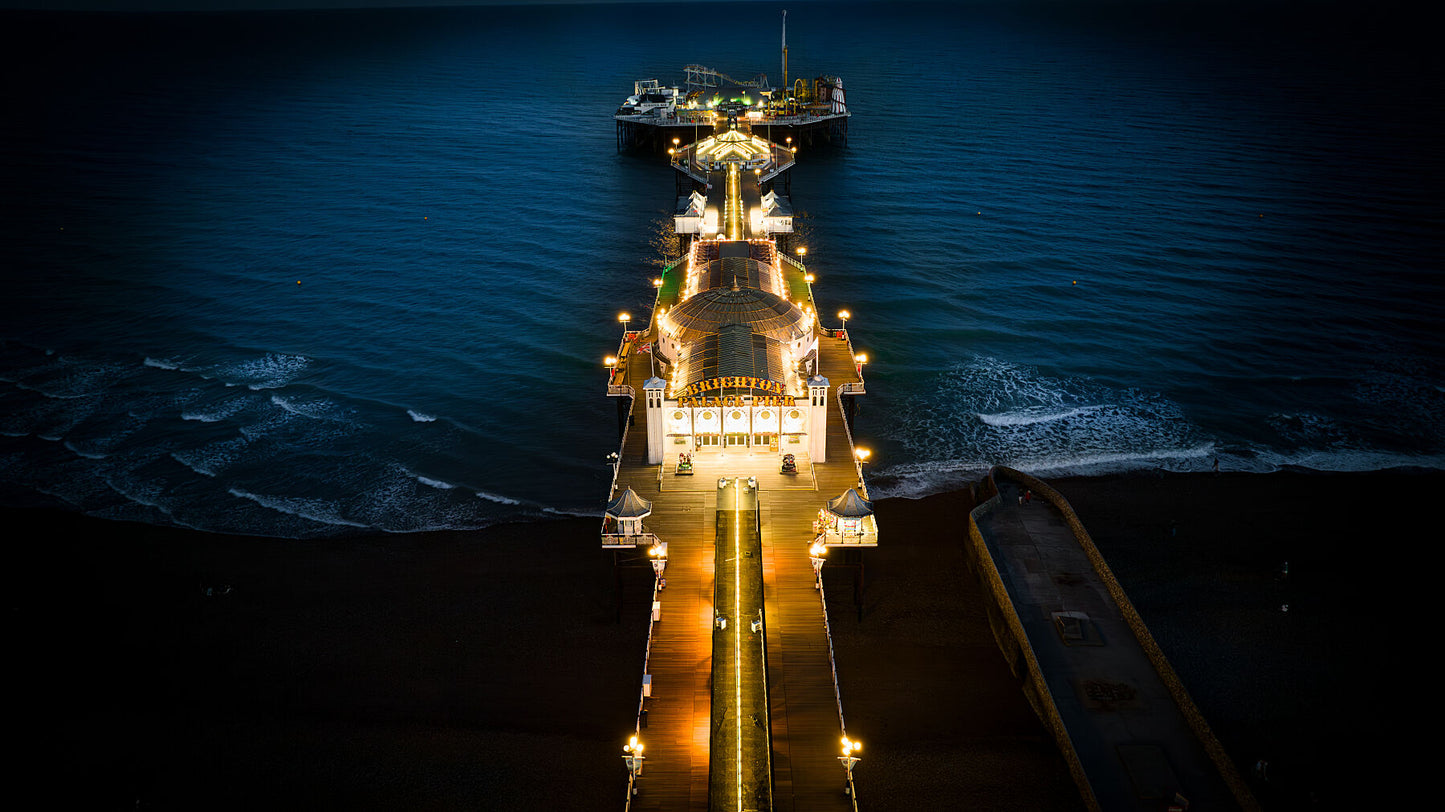 Brighton Pier in lights on a late evening. Print or framed photography art.