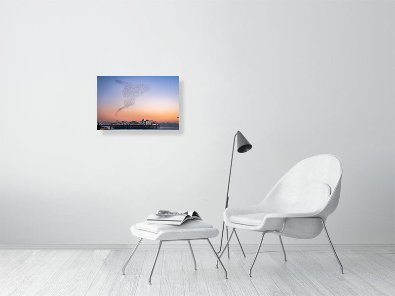 Starling Murmuration over colourful Brighton Pier on a calm sunny evening. Print or framed photography art.