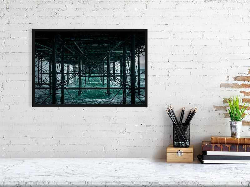 Base structure of Brighton Pier on a windy evening, Print or framed art photography.