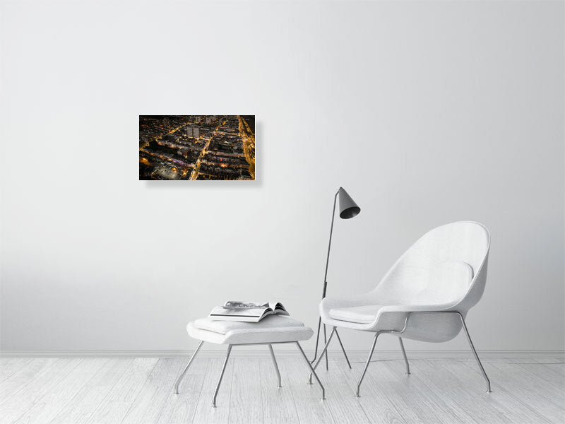 Aerial view of night Brighton with streetlights and web of bright roads. Print or framed art photography.