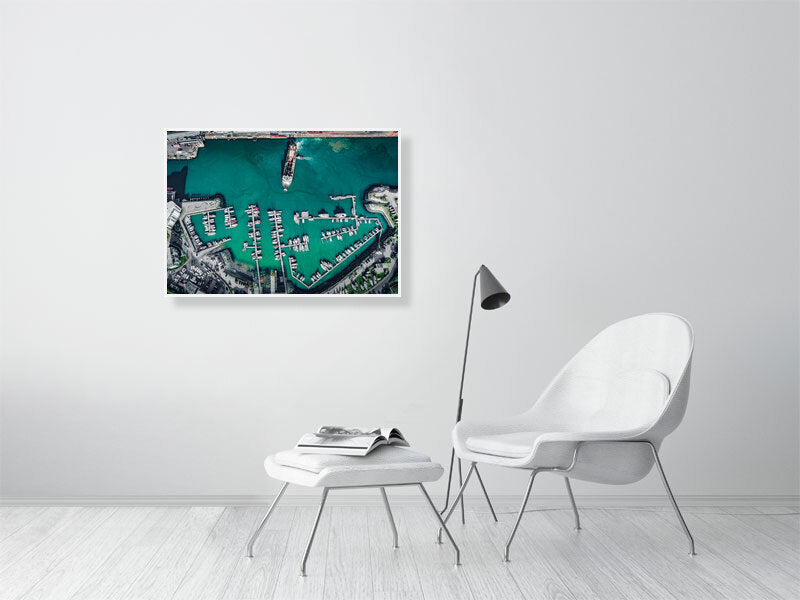 Arrival or departure of a cargo ship in a city port. Framed print photography art.