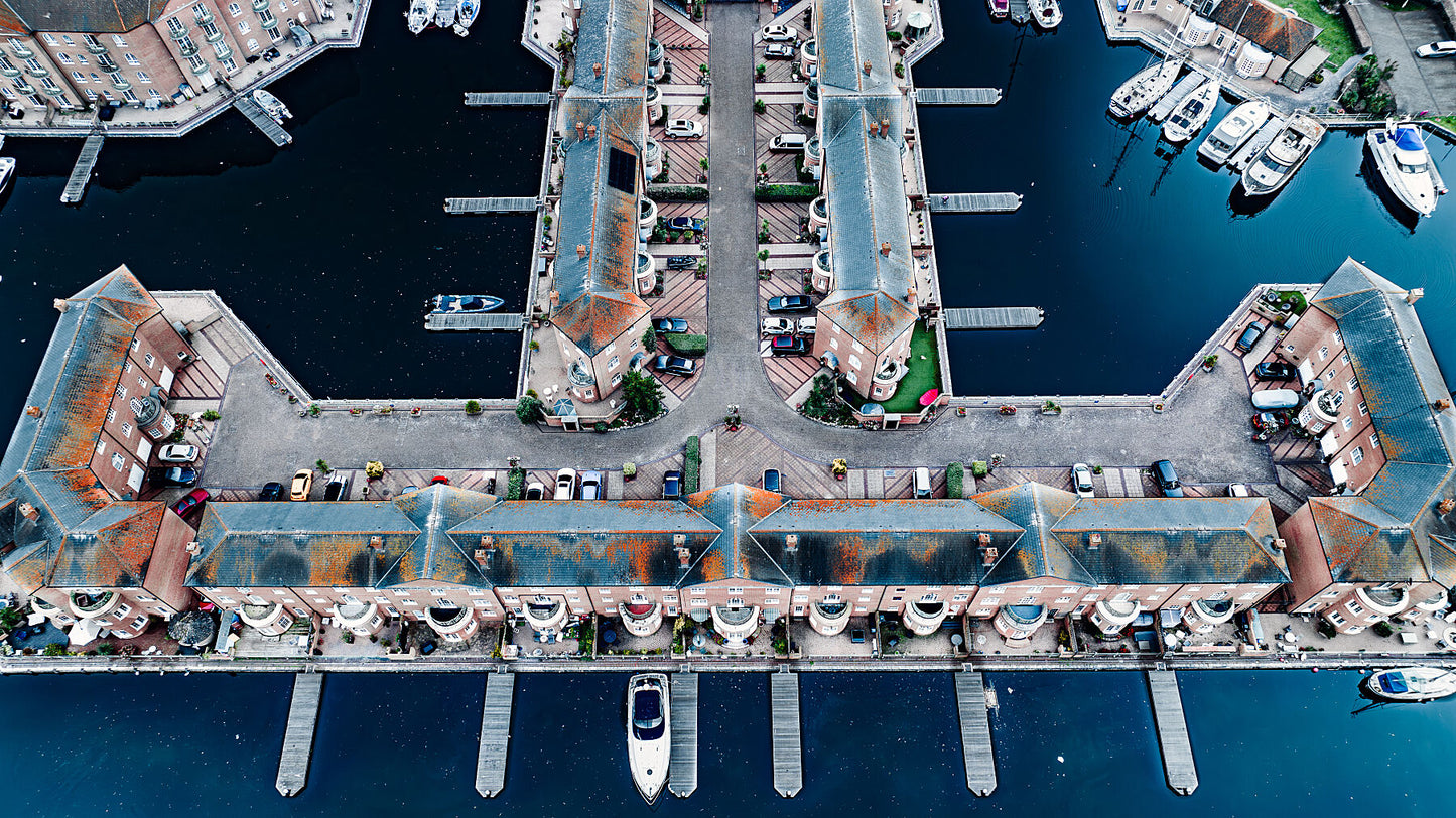 Aerial view of Brighton Marina blue waters with nice building geometry. Print of framed photography art.