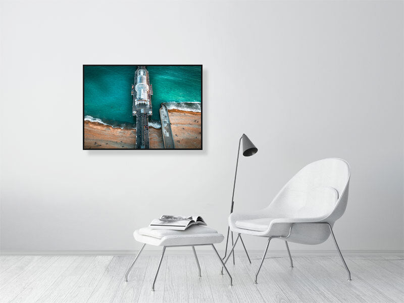 People gathering on a pier to watch sunset falling on Brighton. Print or framed photography art.
