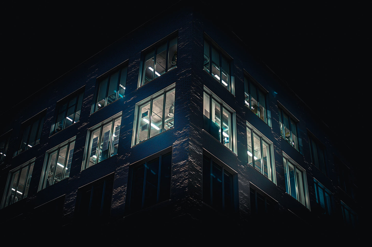 Late night blue office lights, modern building architecture in Brighton. Print or framed photography art.