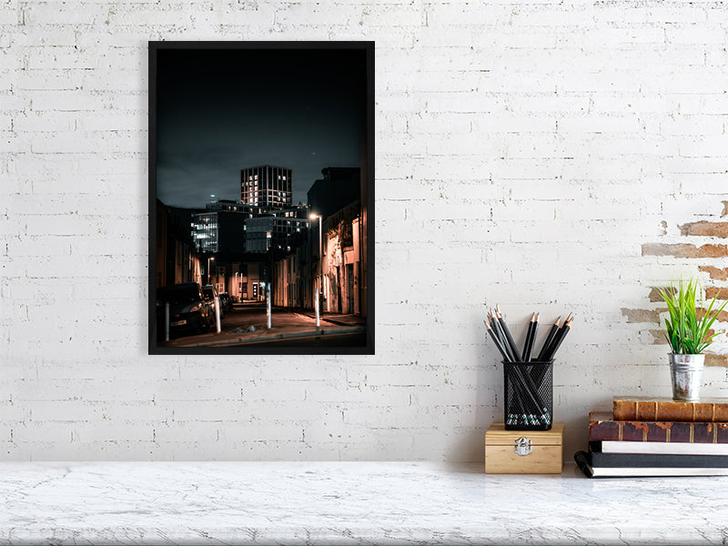 Office building poking out on a background of the residential side of city. Print of framed photography art.
