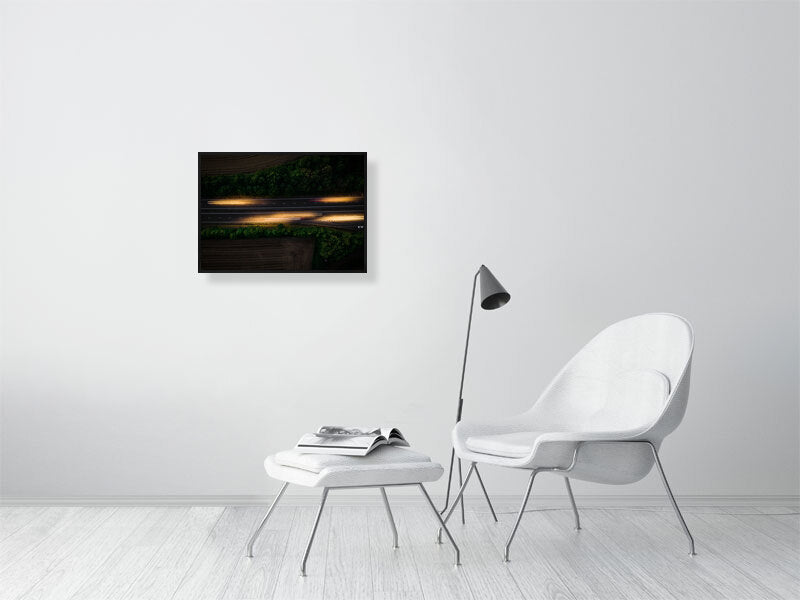 Aerial photo if motorway and light trails left by the cars. Print or framed art photography.