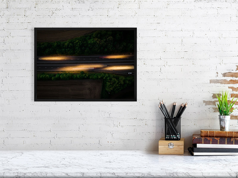 Aerial photo if motorway and light trails left by the cars. Print or framed art photography.