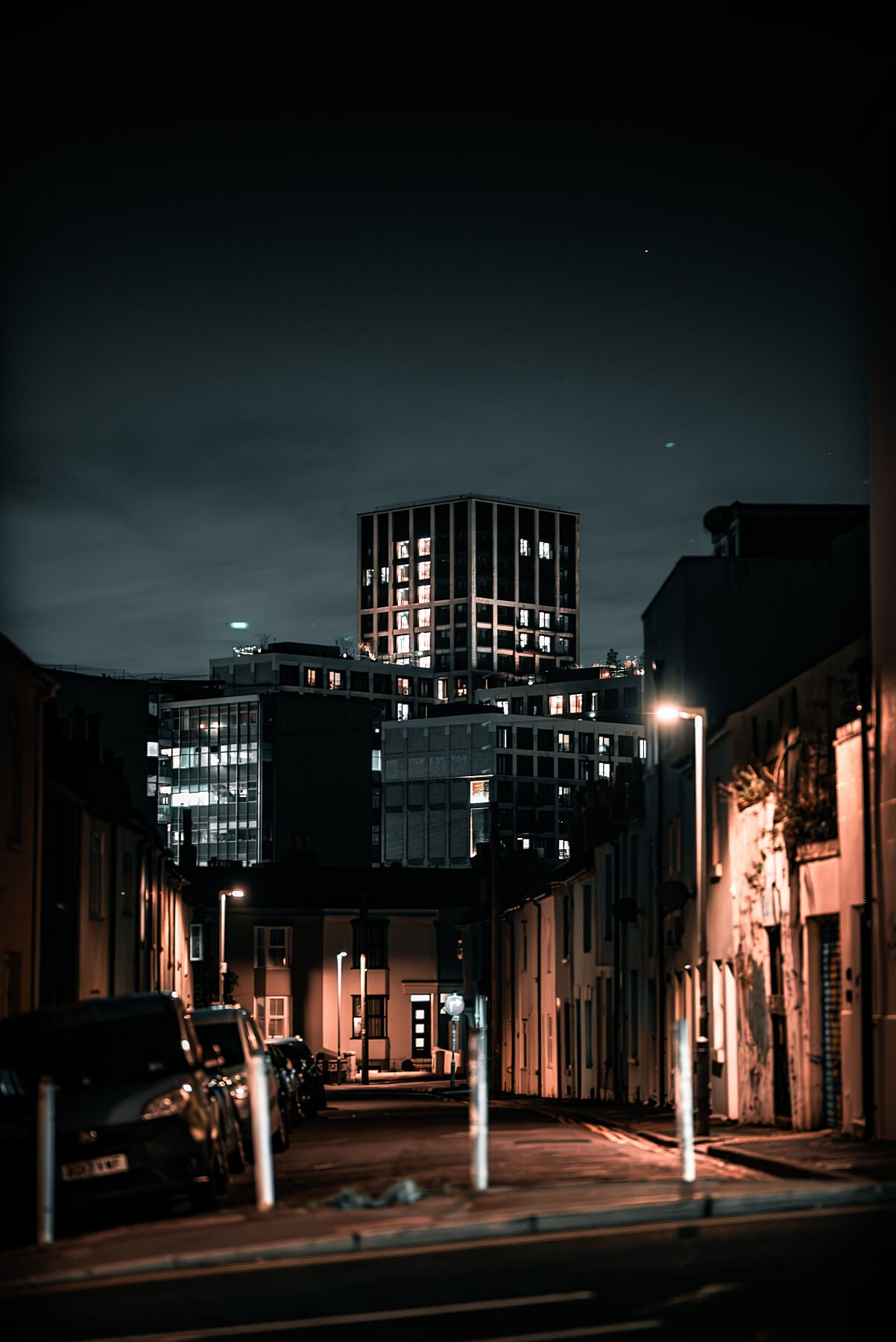 Office building poking out on a background of the residential side of city. Print of framed photography art.