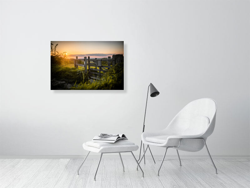 Gate in a wooden fence on a footpath toward a field on a tall hill close to Brighton. Printed or framed art photography.