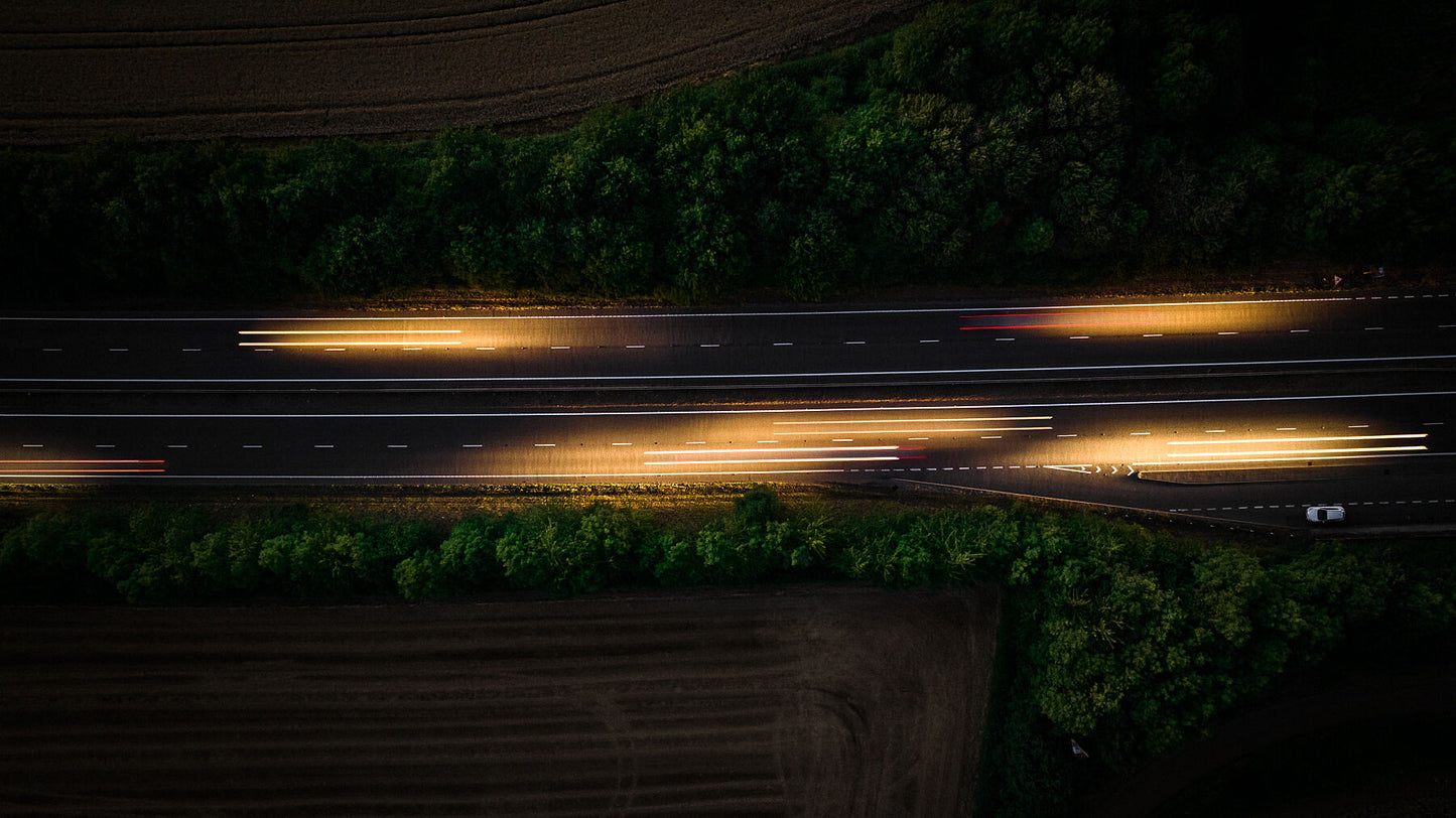 Aerial photo if motorway and light trails left by the cars. Print or framed art photography.