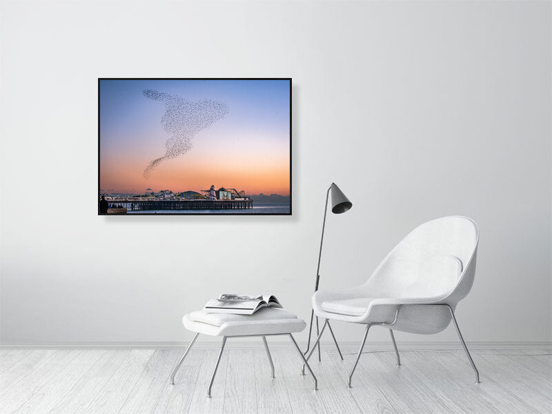Starling Murmuration over colourful Brighton Pier on a calm sunny evening. Print or framed photography art.