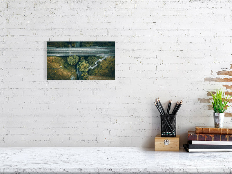 8232250-2843986Aerial view of a small rail bridge over the road with footpath and steps leading to it. Print of Framed Photography art, wall decor.