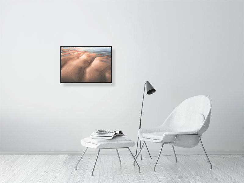 Man with the dog on a desert like beach on tide out, Wales. Print or framed photography art.