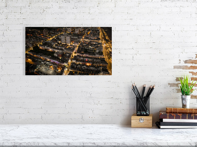 Aerial view of night Brighton with streetlights and web of bright roads. Print or framed art photography.