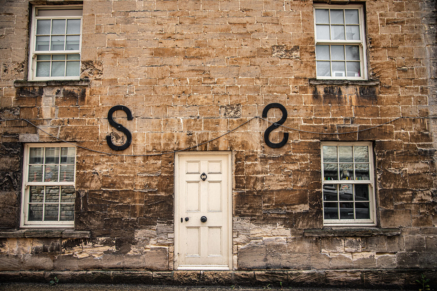 Old limescale brick building in historic town of Northleach, Cheltenham, Cotswold. Print or framed art photography, wall decor.