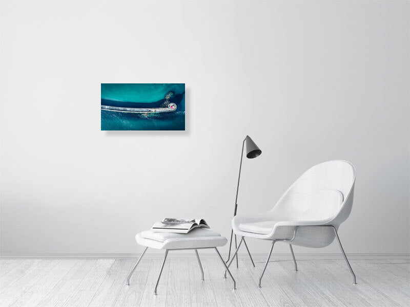 Aerial view of Newhaven lighthouse and wave breakers in clear, blue waters. Print or framed photography art.