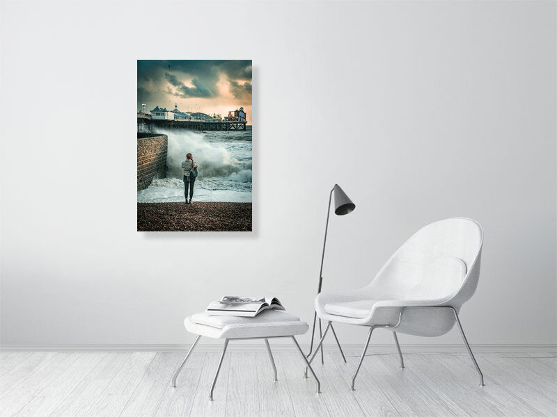 Random spectator watching waves on a windy autumn day by Brighton Pier. Print or framed photography art.