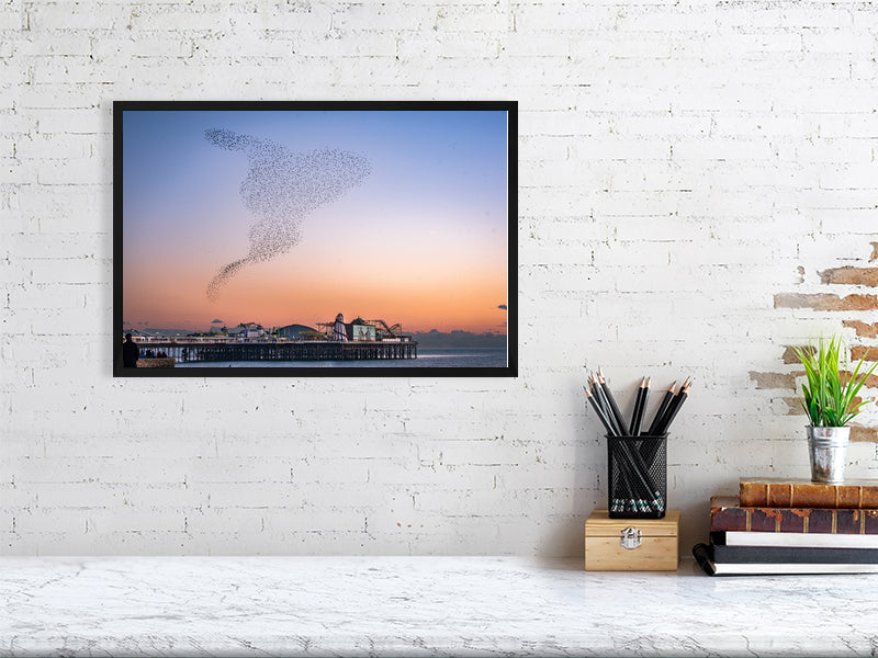 Starling Murmuration over colourful Brighton Pier on a calm sunny evening. Print or framed photography art.
