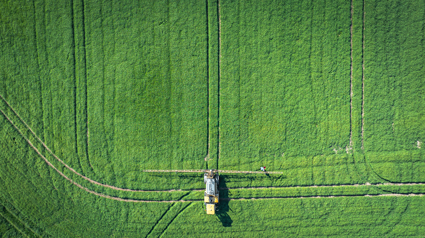 East Sussex fields close to Brighton, Ditchling, UK Agricultural machinery in action on field of crop. Framed or unframed print, photography art.