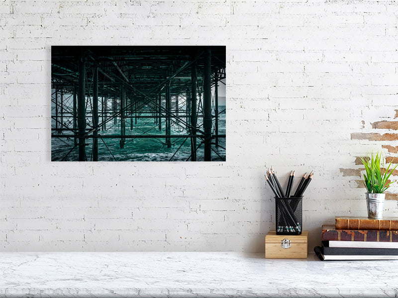 Base structure of Brighton Pier on a windy evening, Print or framed art photography.