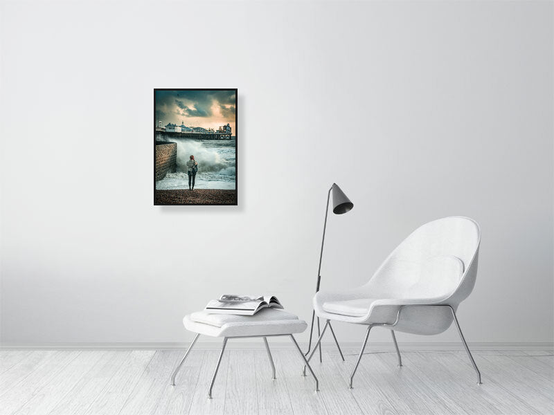 Random spectator watching waves on a windy autumn day by Brighton Pier. Print or framed photography art.