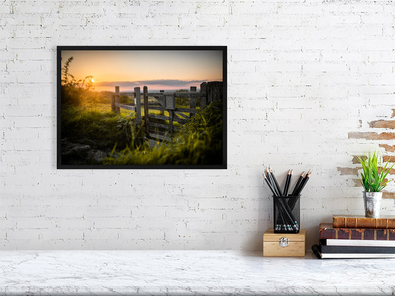 Gate in a wooden fence on a footpath toward a field on a tall hill close to Brighton. Printed or framed art photography.