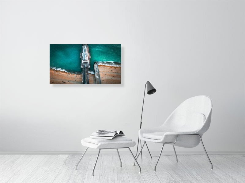People gathering on a pier to watch sunset falling on Brighton. Print or framed photography art.