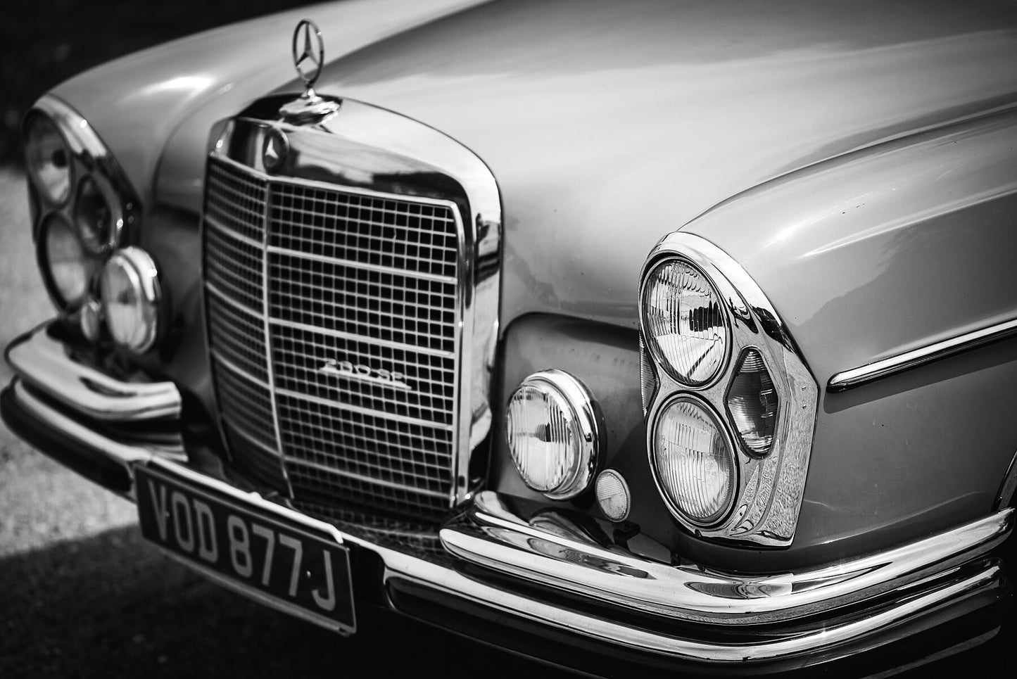 Classic, luxury Mercedes-Benz W109 W108 280SE in black and white. Print or framed art photography.