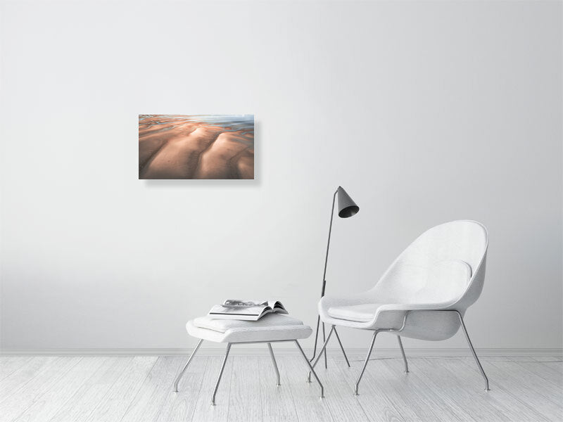 Man with the dog on a desert like beach on tide out, Wales. Print or framed photography art.