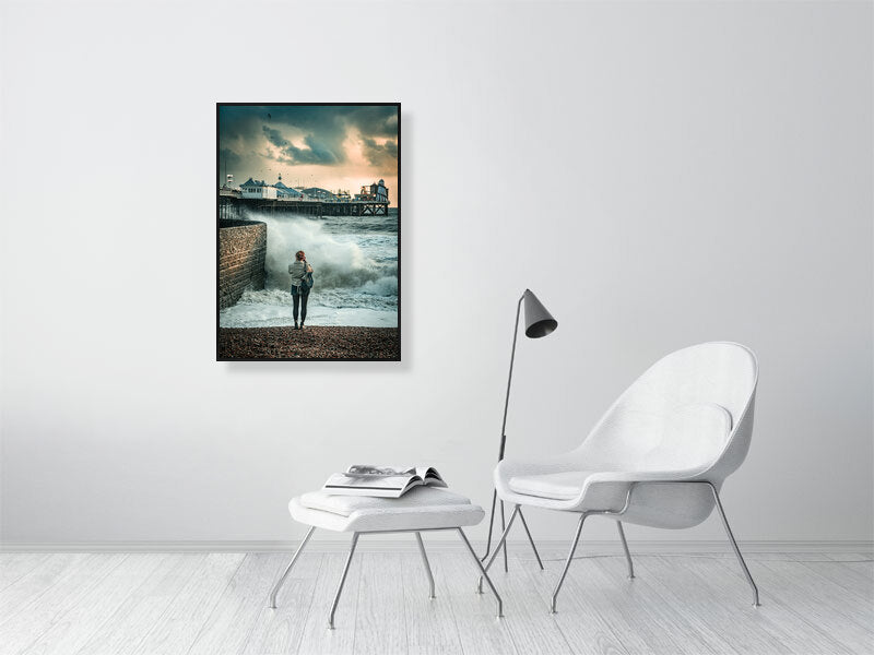 Random spectator watching waves on a windy autumn day by Brighton Pier. Print or framed photography art.