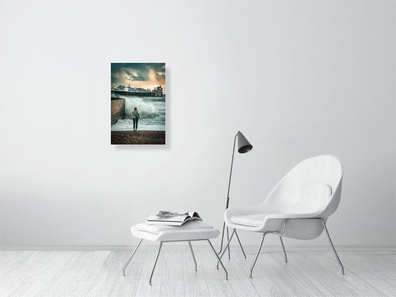 Random spectator watching waves on a windy autumn day by Brighton Pier. Print or framed photography art.