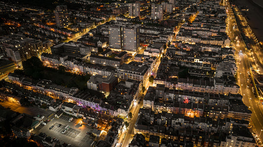 Aerial view of night Brighton with streetlights and web of bright roads. Print or framed art photography.