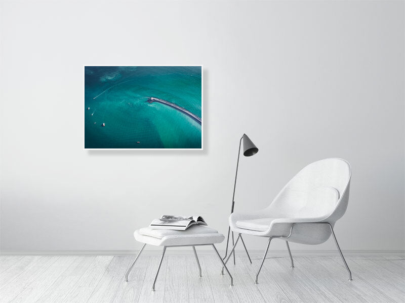 Lighthouse in blue waters of England. Framed print photography art.