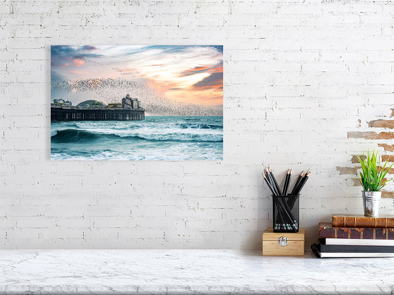 Starling murmuration over Brighton Pier on a windy evening. Print or framed photography art.