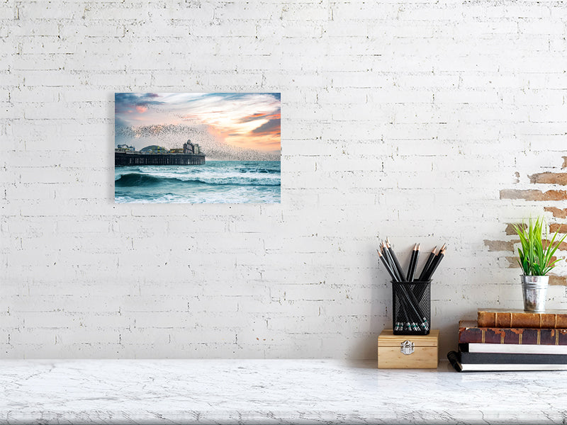 Starling murmuration over Brighton Pier on a windy evening. Print or framed photography art.