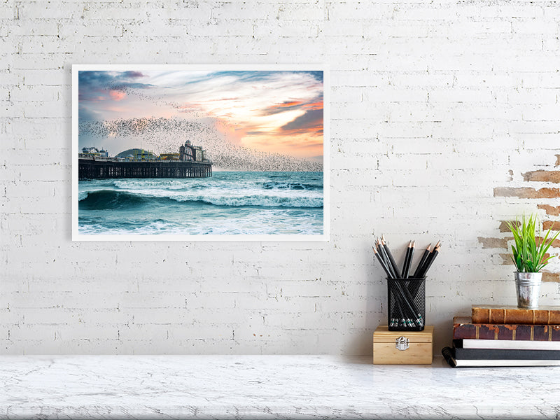 Starling murmuration over Brighton Pier on a windy evening. Print or framed photography art.