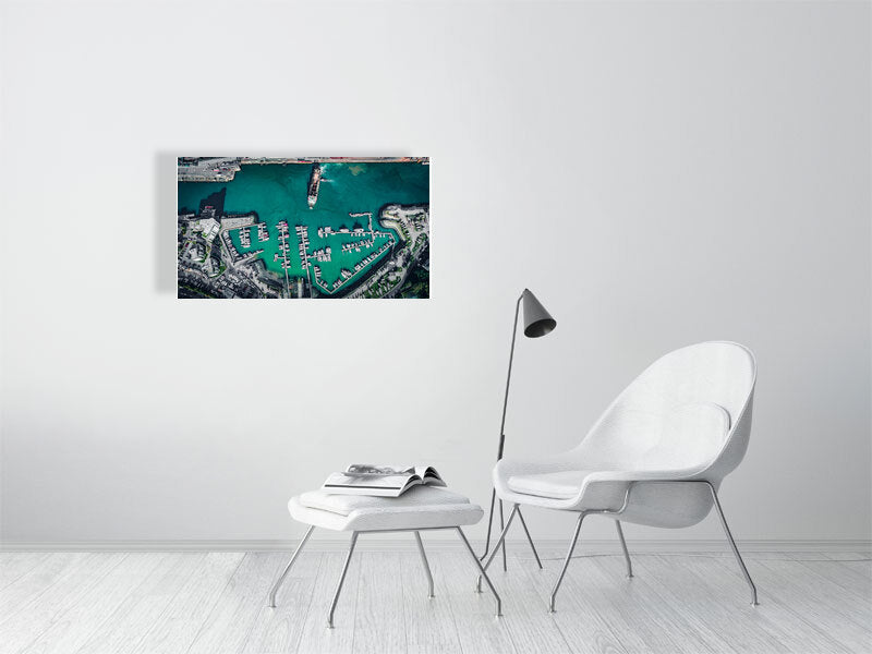 Arrival or departure of a cargo ship in a city port. Print photography art.