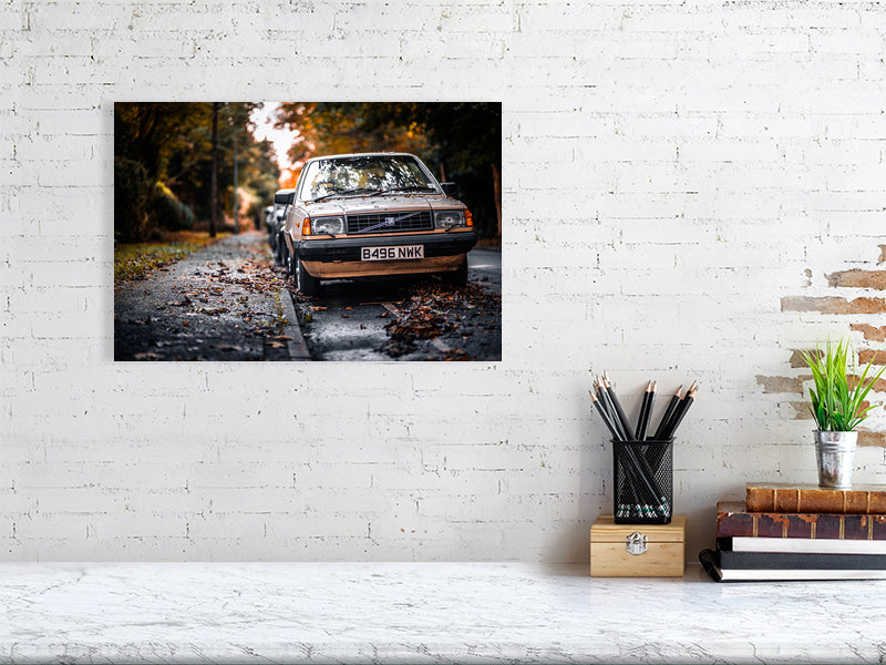 Old, classic Volvo in a colours of the fall on a wet but bright day. Print of framed photography art.