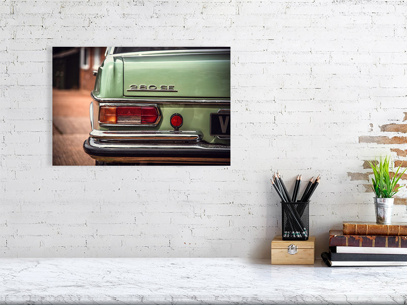 Classic, luxury Mercedes-Benz W109 W108 sitting outside the garage in a sunny day. Print or framed art photography.