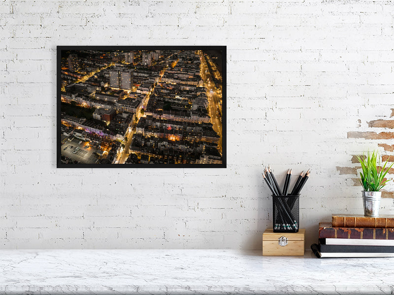 Aerial view of night Brighton with streetlights and web of bright roads. Print or framed art photography.