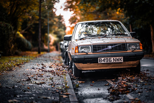 Old, classic Volvo in a colours of the fall on a wet but bright day. Print of framed photography art.