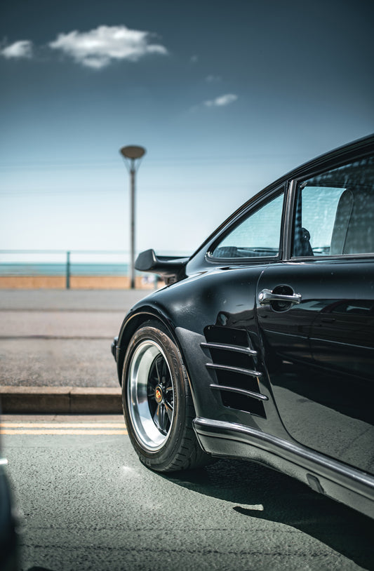Classic Porsche 911 (930) Turbo in black, taken on a seafront in Brighton. Photography print, unframed. Automotive art print. Wall decor