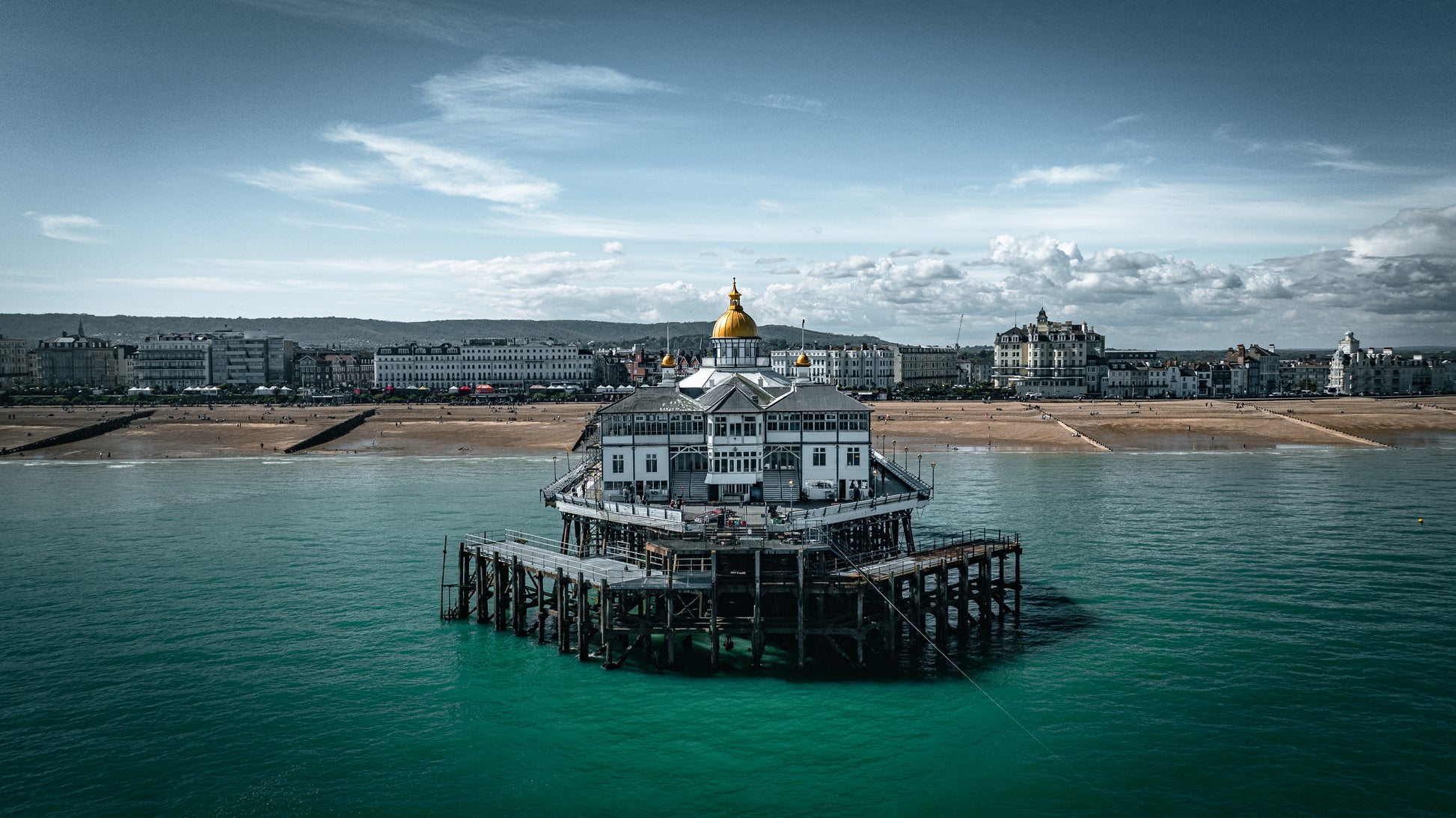 Eastbourne Pier and sunny beach, East Sussex, UK. Wall decor, unframed print