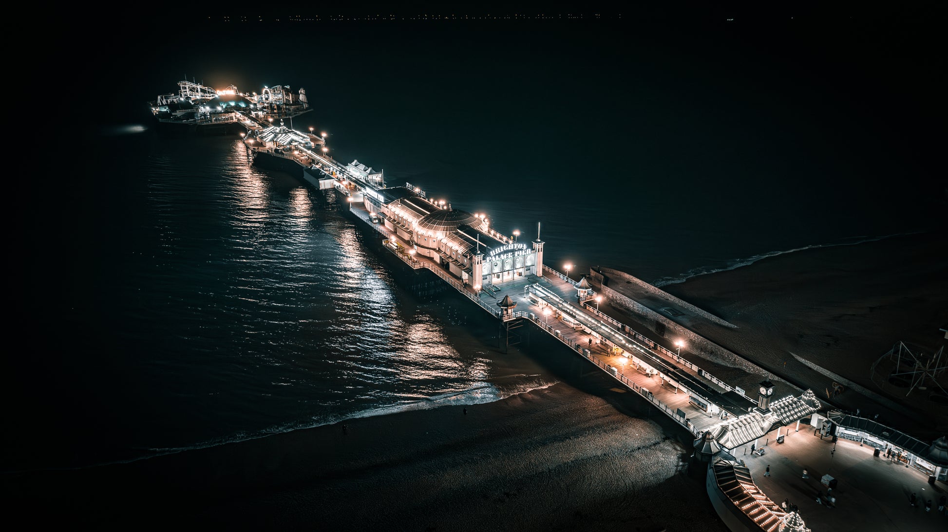 Brighton Pier on a cold winter Saturday night, surrounded by lights. Print or framed photography art.