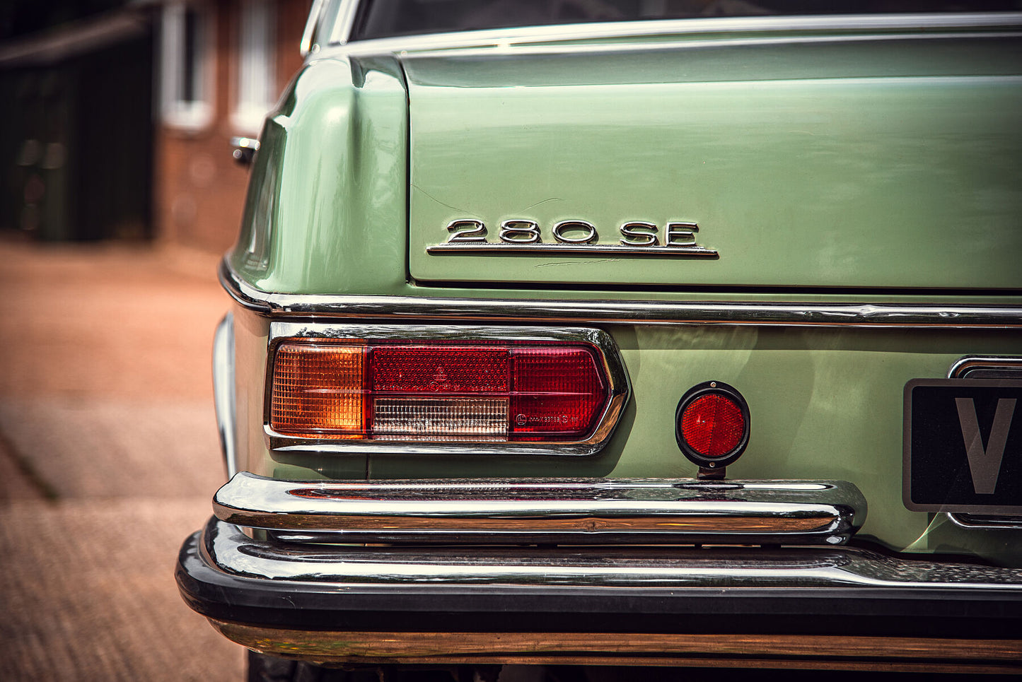 Classic, luxury Mercedes-Benz W109 W108 sitting outside the garage in a sunny day. Print or framed art photography.