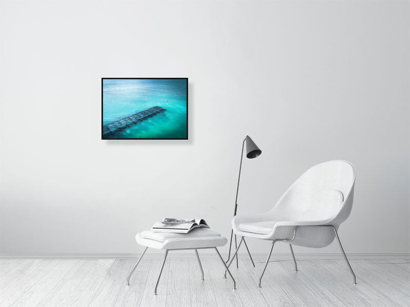 Blue waters of Lancing beach with remains of some wooden structure. Print or framed photography art.