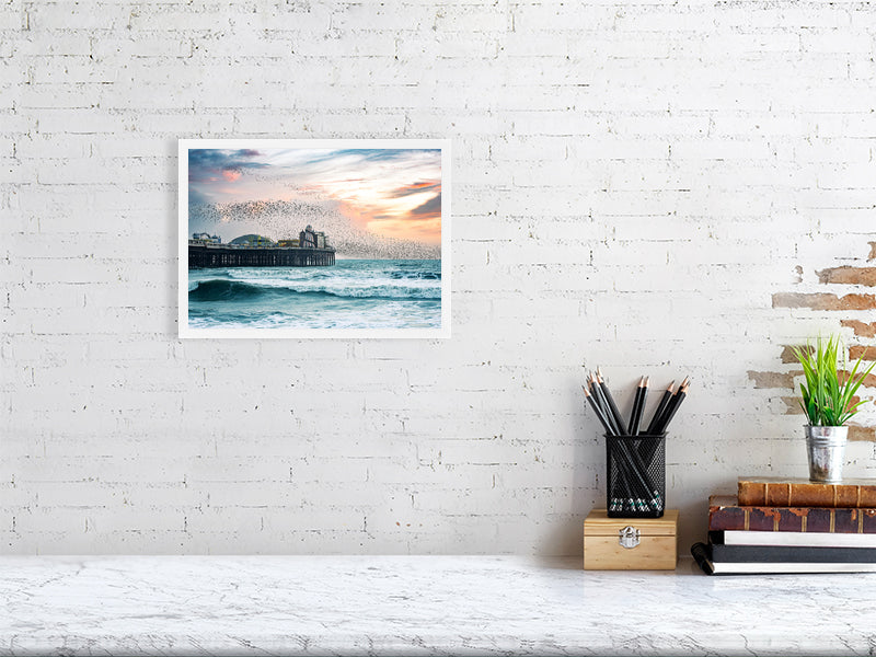 Starling murmuration over Brighton Pier on a windy evening. Print or framed photography art.