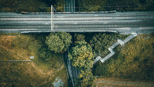 Aerial view of a small rail bridge over the road with footpath and steps leading to it. Print of Framed Photography art, wall decor.