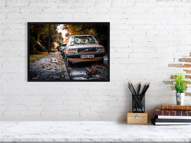 Old, classic Volvo in a colours of the fall on a wet but bright day. Print of framed photography art.